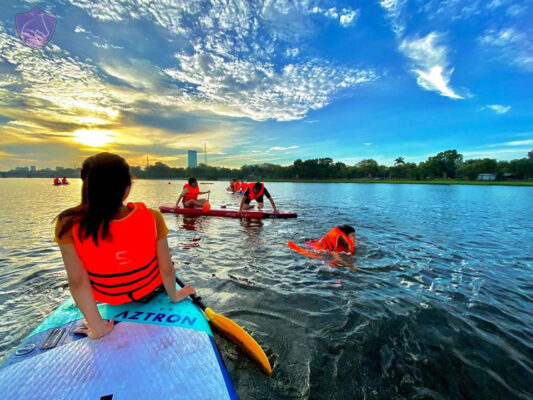 Surfing sup on the Perfume River- Cuture Pham Travel