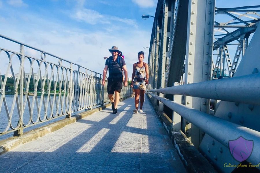 Walking along Truong Tien Bridge